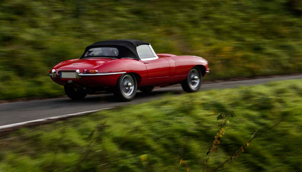 A flaming red Jaguar E-Type 4.2 Spider