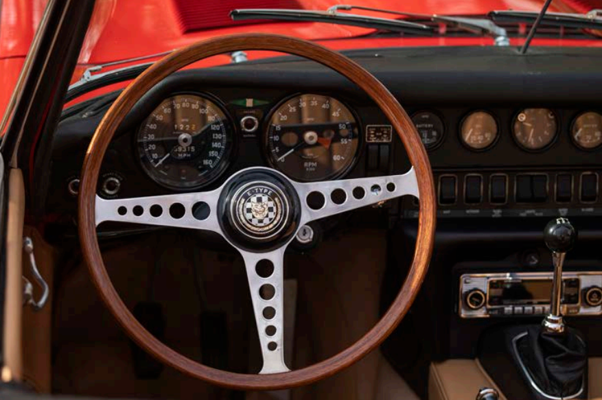 A flaming red Jaguar E-Type 4.2 Spider