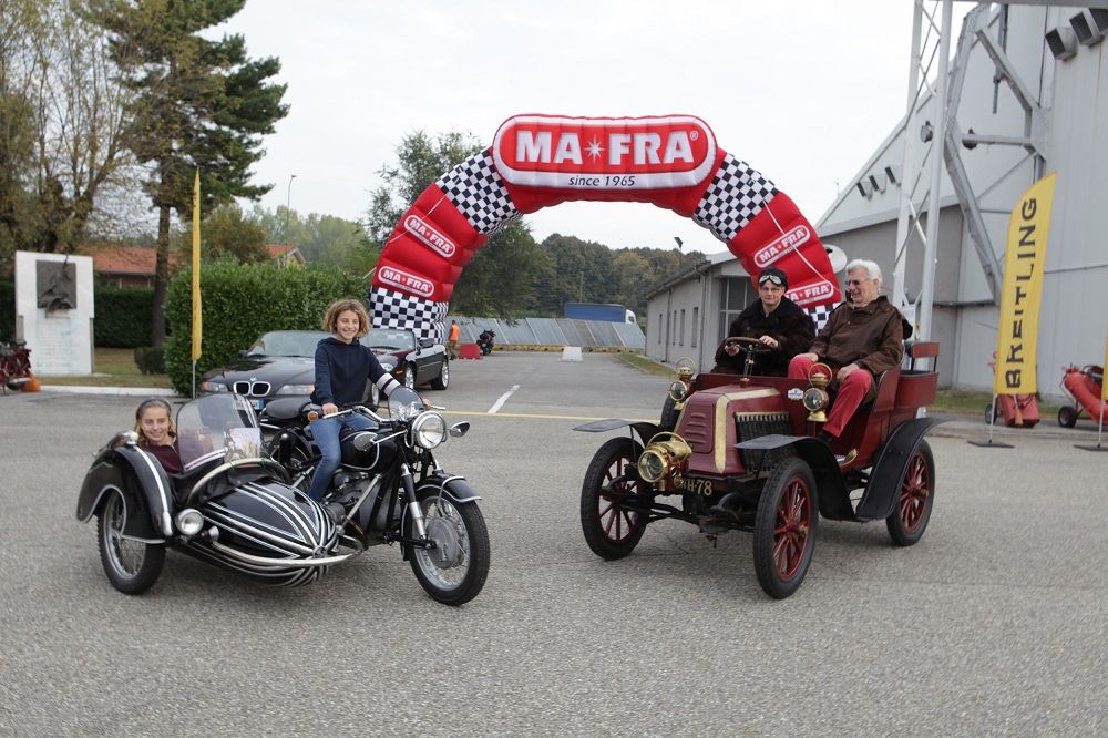 The vintage cars and motorcycles of the Milan Trophy ready for a new fashion show at Castello Sforzesco. Launch of the 13th Edition organized by the C