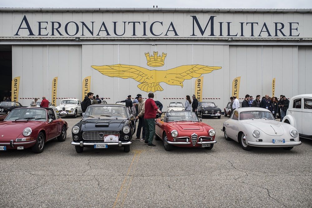 The vintage cars and motorcycles of the Milan Trophy ready for a new fashion show at Castello Sforzesco. Launch of the 13th Edition organized by the C